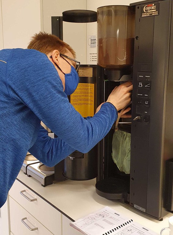 2021_jan_Mikkel fixing coffee machine and saving the department from a sad day.jpg